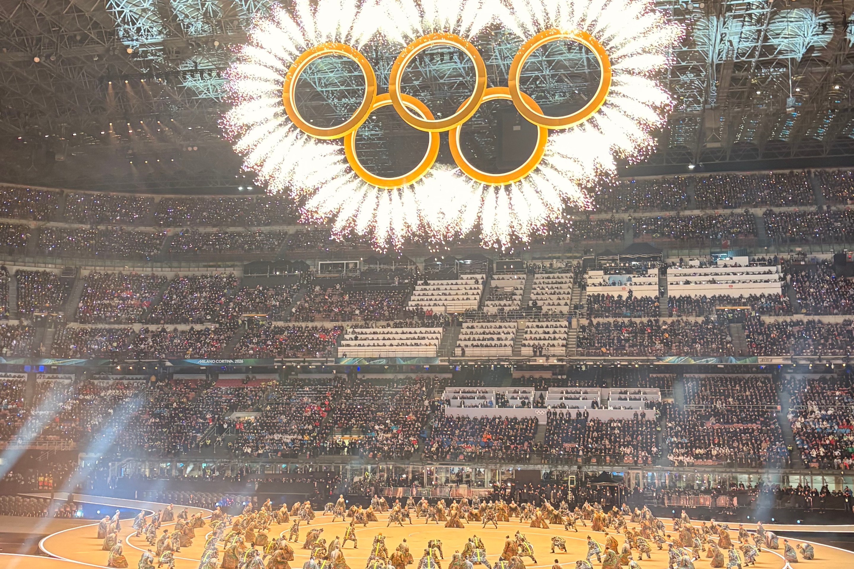 Olympic rings lit inside San Siro Stadium during Opening Ceremony