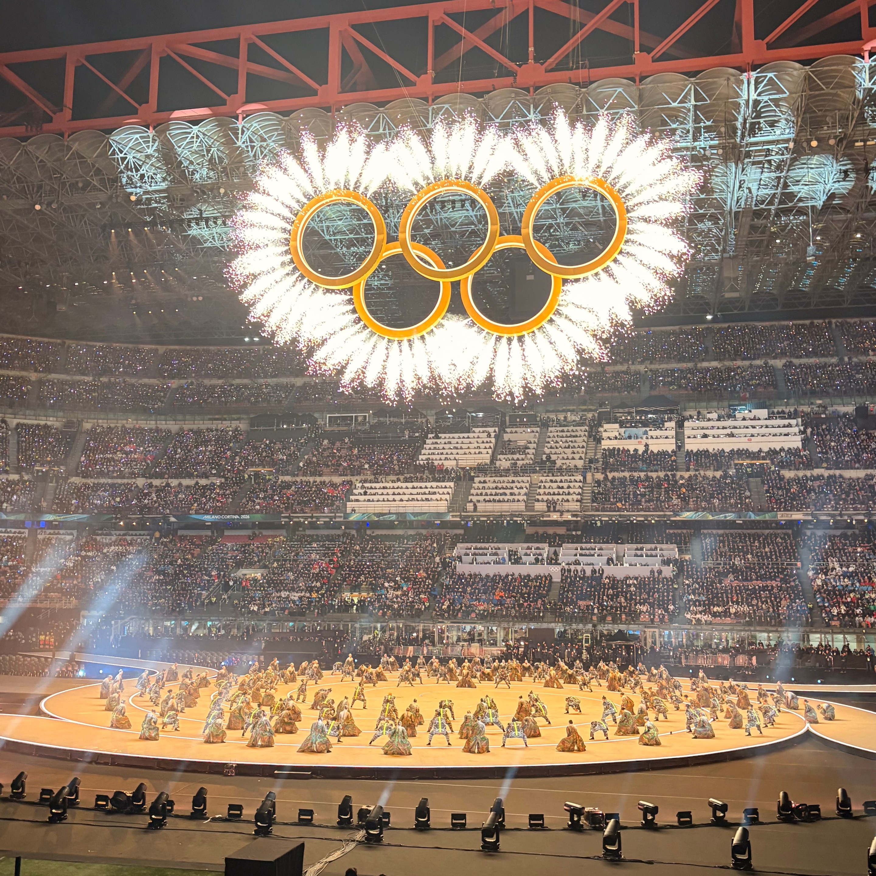 Olympic rings lit inside San Siro Stadium during Opening Ceremony