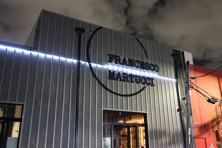 Exterior view of Francesco Martucci Miami restaurant in Wynwood at night.