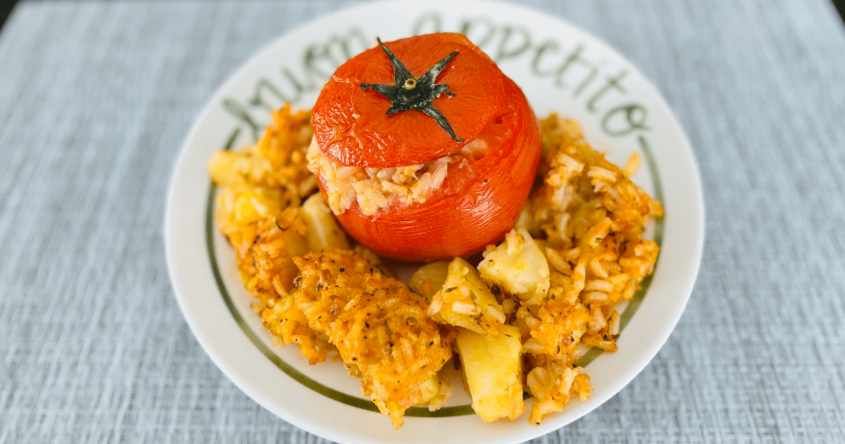 Single Roman rice stuffed tomato served with roasted potatoes.