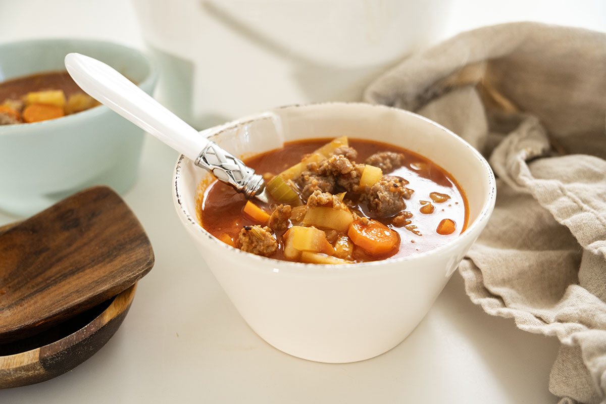 Italian sausage and cannellini bean soup with vegetables in tomato broth