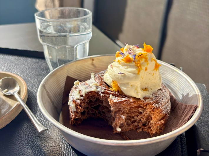 Flaky pastry topped with cream and citrus zest at Grani Farine Monteverde