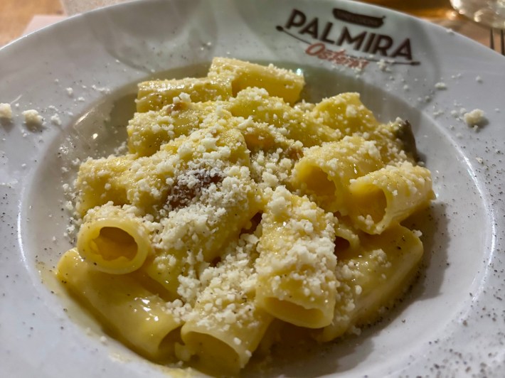 Rigatoni carbonara topped with pecorino at Osteria Palmira Rome