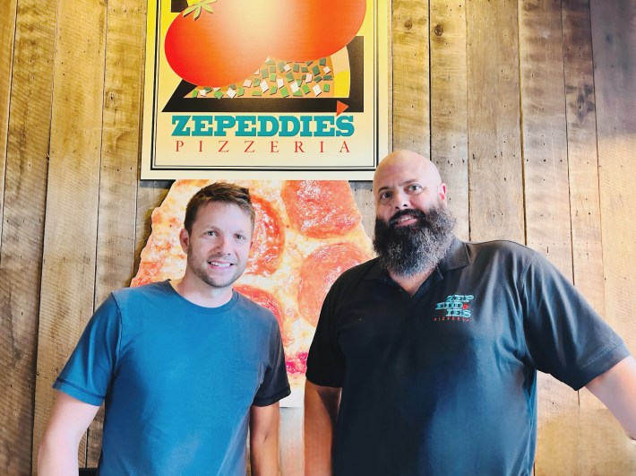Brian and Peter Zepsa standing inside Zepeddie’s Pizzeria in Charlotte