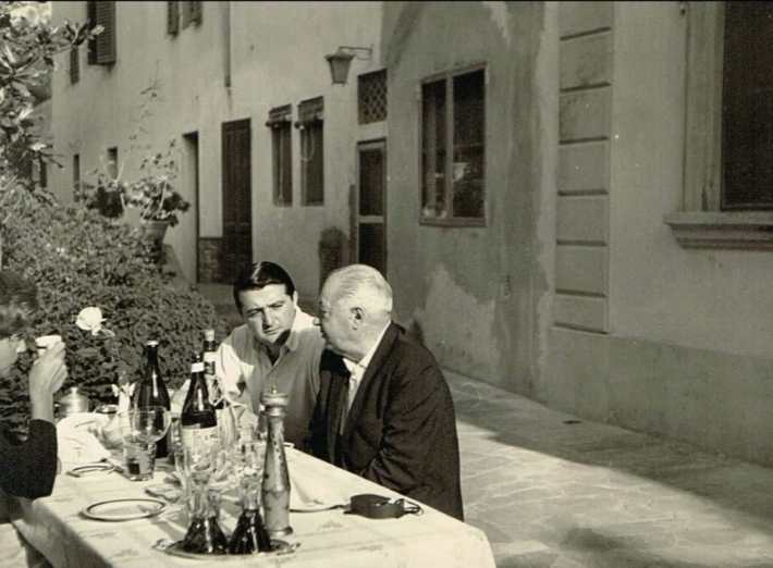 Mario Tucci & Oscar Tucci dining al fresco.