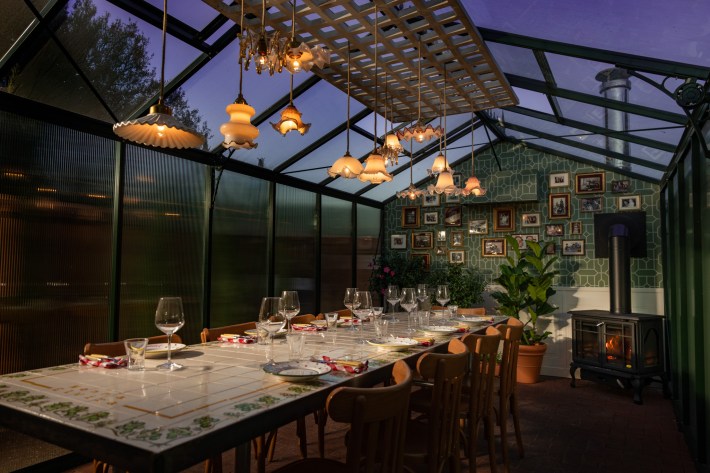 The Giardino di Nonna greenhouse dining space at Elvira.