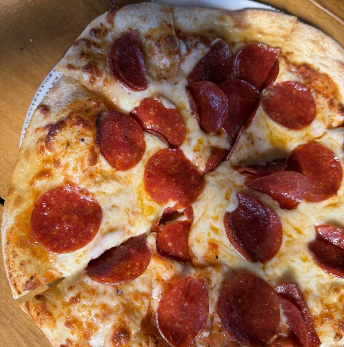 classic pepperoni pie, golden at the edges and ready to share at The Farmhouse at Roger’s Gardens in Newport Beach.