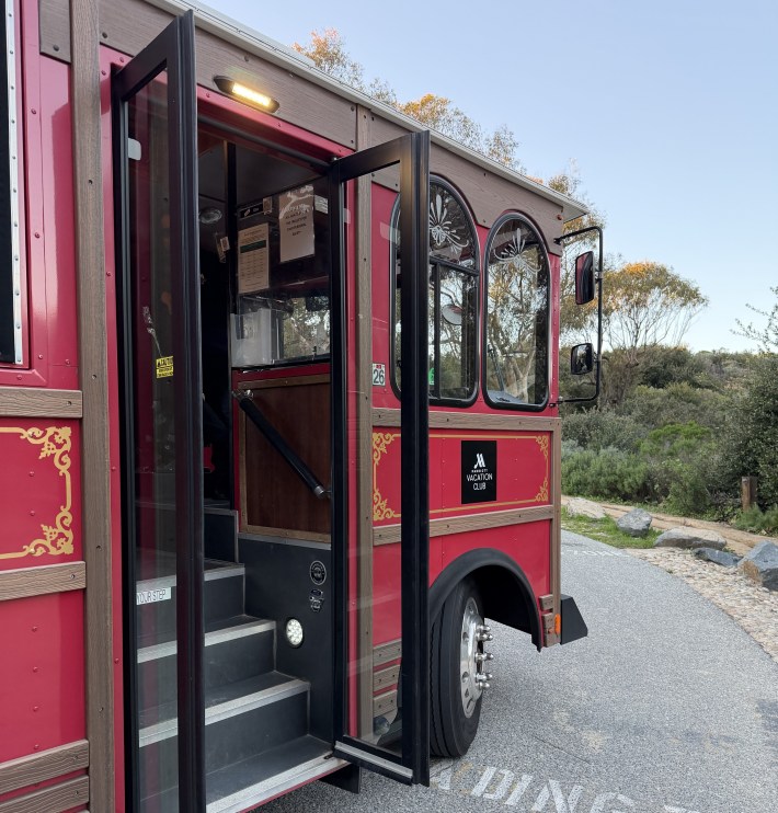 Red trolley from Marriott Vacation Club parked near Crystal Cove