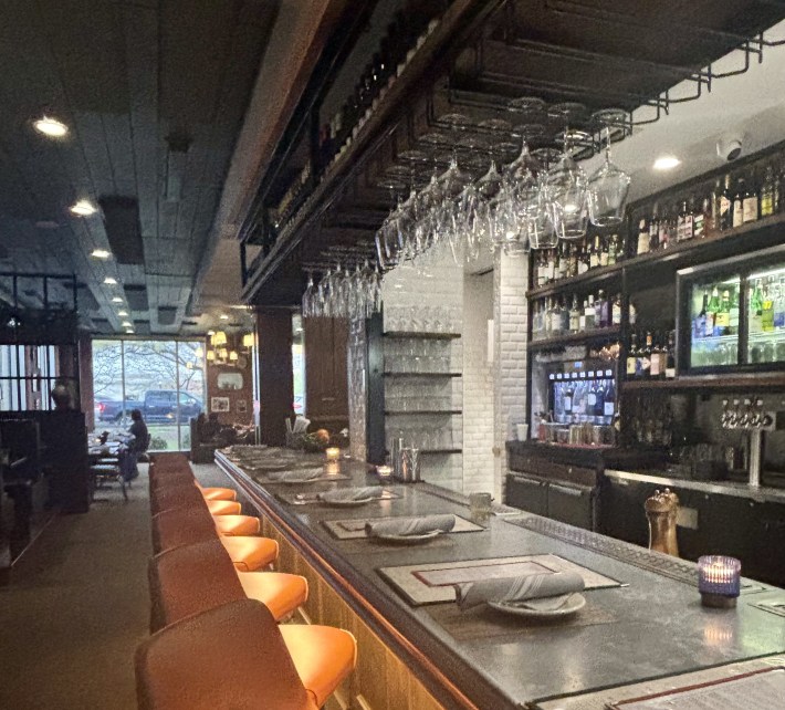 The bar at Little Mama’s sets the tone with warm lighting and classic Italian details