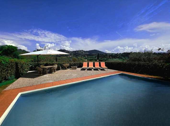 Plunge under the Tuscan sun while enjoying majestic views of Fiesole at Villa Tucci in Firenze