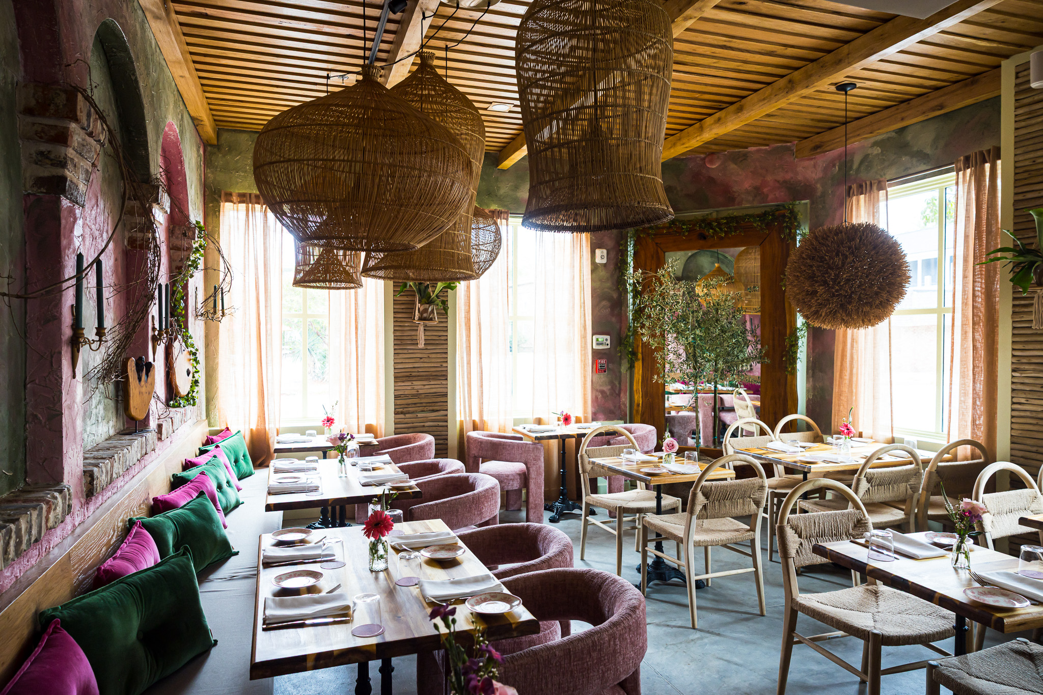 Allora Charleston dining room with colorful seating and pendant lighting