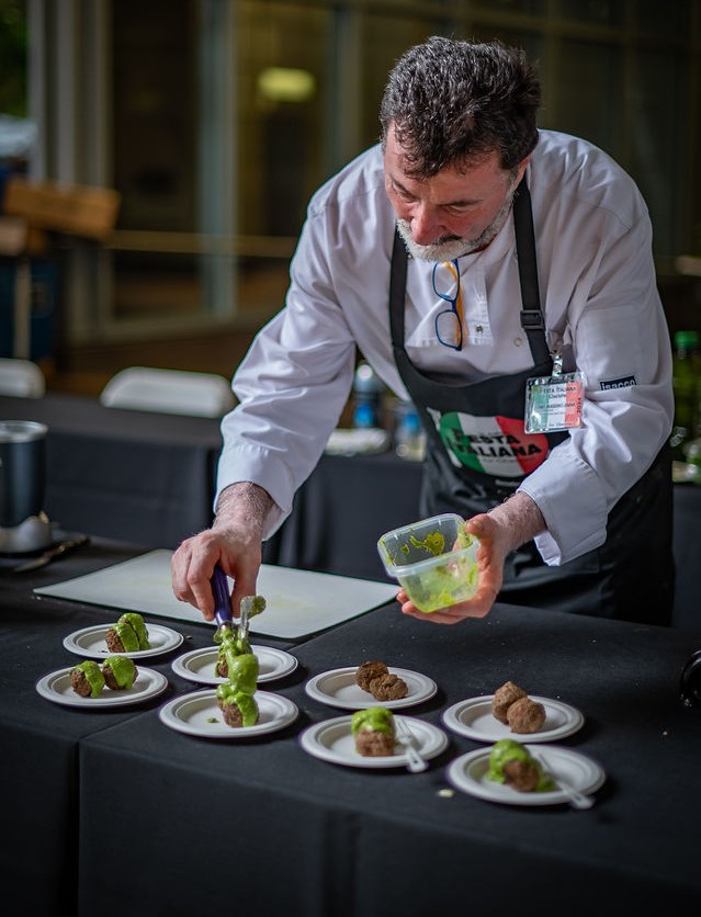 Chefs prepare and plate dishes live, giving guests a closer look at the craft behind each bite.