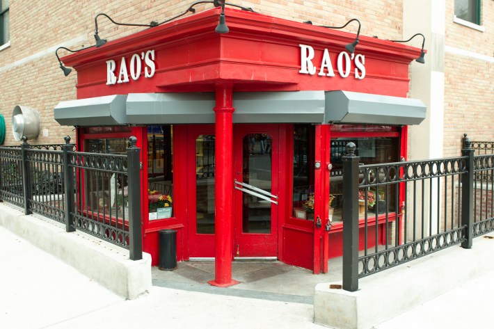 Exterior of Rao’s restaurant in Harlem with iconic red facade