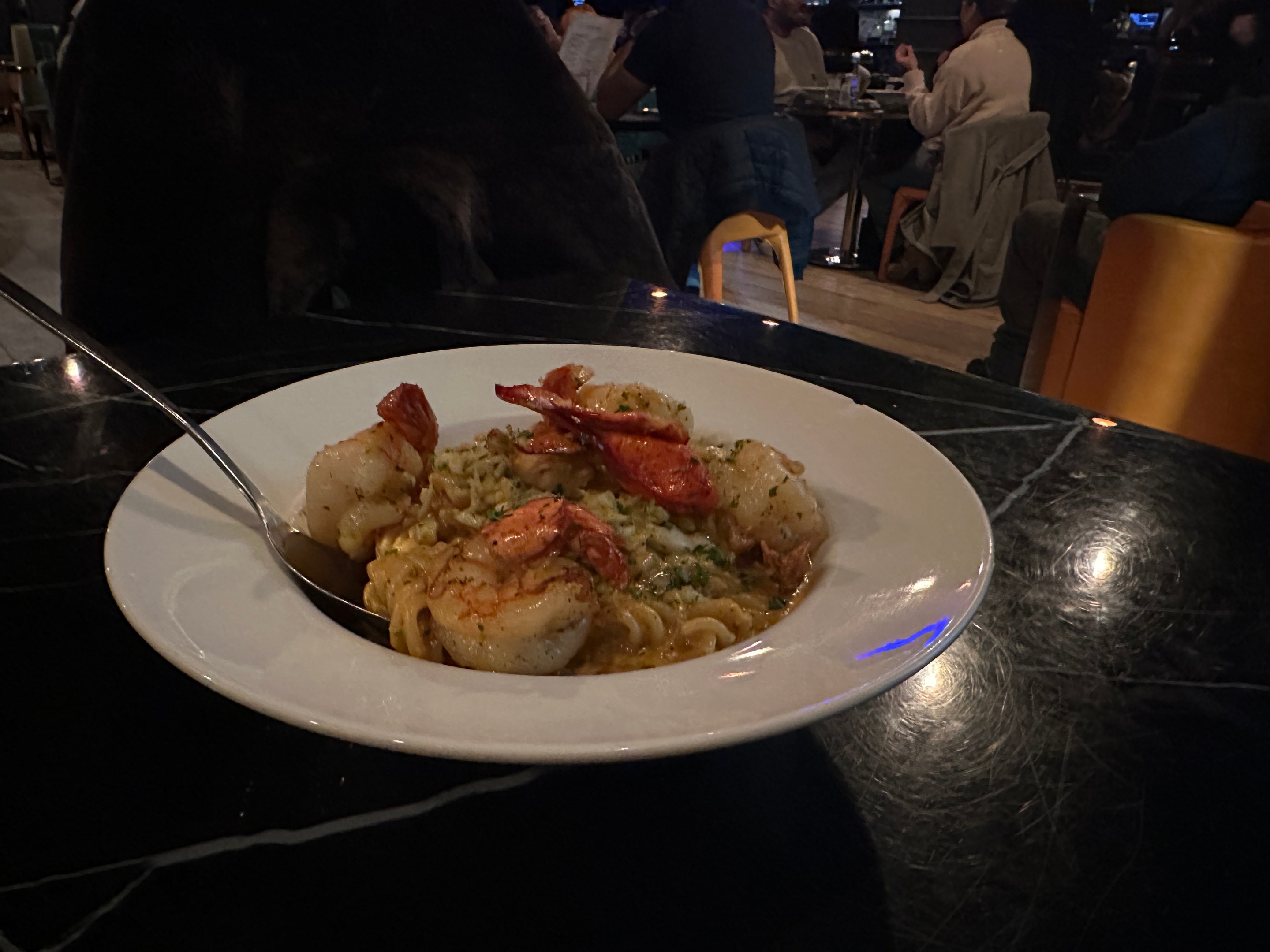 Seafood trio with lobster, scallops, and shrimp pasta at Provare Chicago