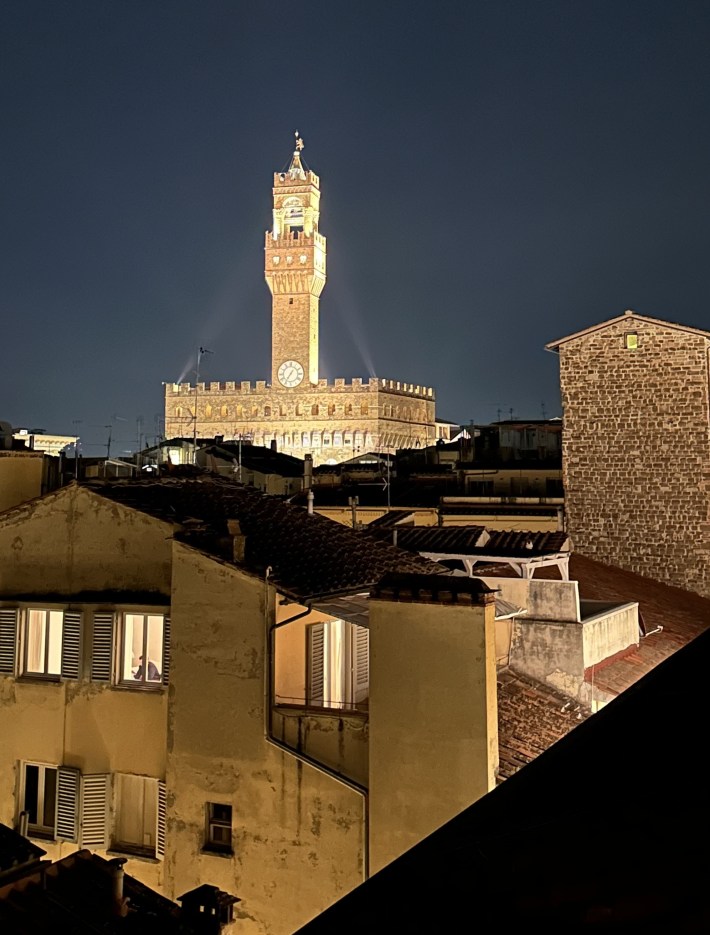 Night view of Palazzo Vecchio and Florence skyline from 701 Rooftop Bar