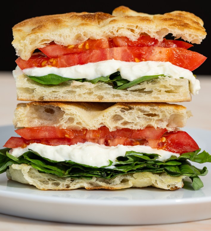 Caprese sandwich on focaccia with tomato, basil, and stracciatella at Ronnie’s Pronto