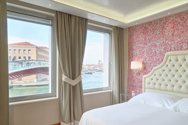 A deluxe room with canal views at Hotel Santa Chiara.