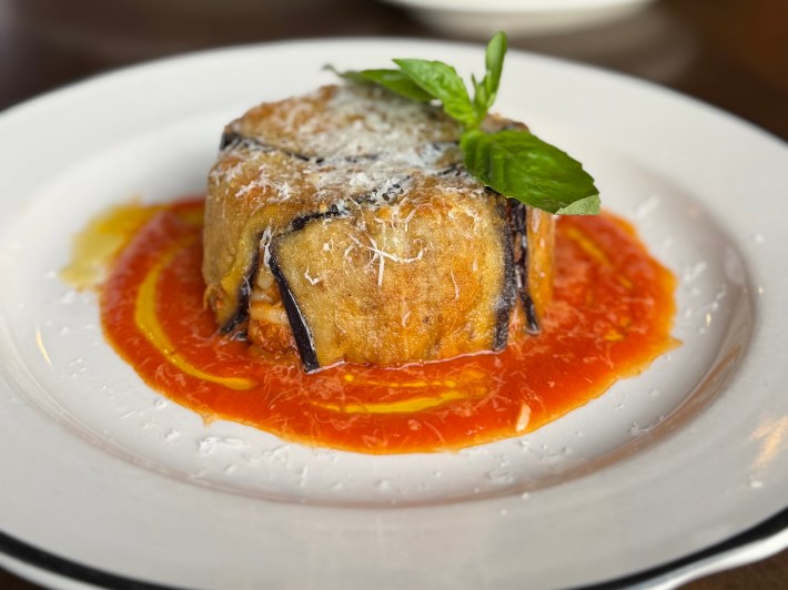 Close-up of Sicilian timballo with eggplant crust and pasta filling
