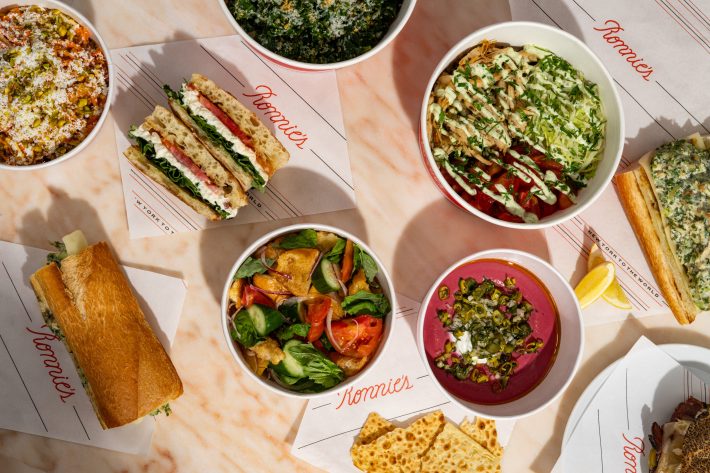 Overhead spread of sandwiches, salads, and bowls from Ronnie’s Pronto