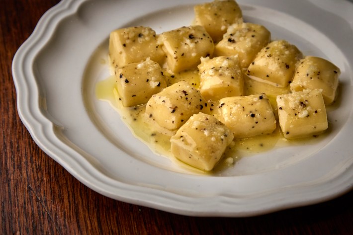 Cacio e pepe ricotta dumplings with black pepper and cheese at Alla Vita