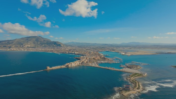 Aerial view of Trapani’s old port with Mount Erice rising in the background. (National Geographic) TUCCI IN ITALY