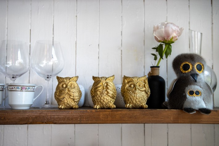Decorative owl figurines displayed inside The Little Owl restaurant.
