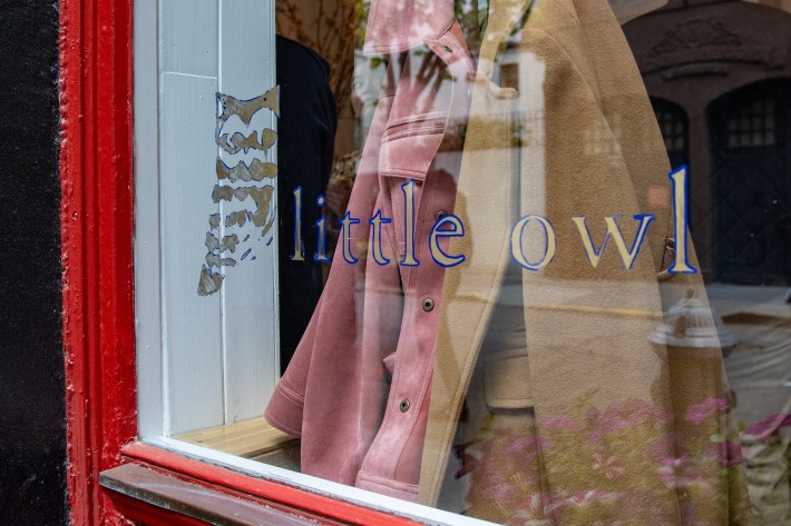 The Little Owl logo displayed on the restaurant window in Greenwich Village.