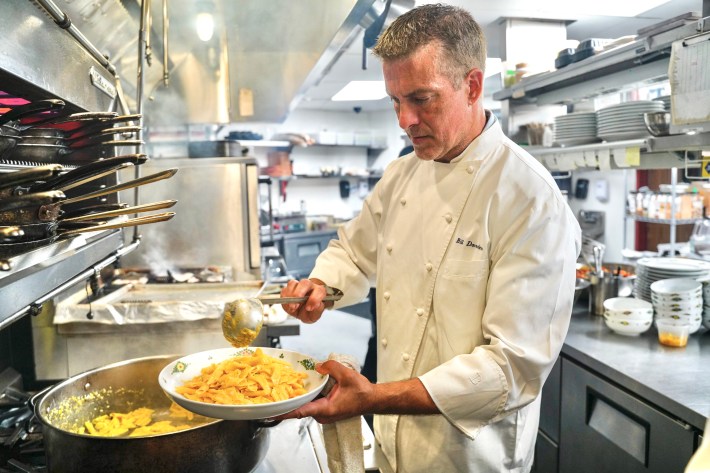 Chef Bill Dorrler prepares fresh pasta in the kitchen at Piccolo MORINI.