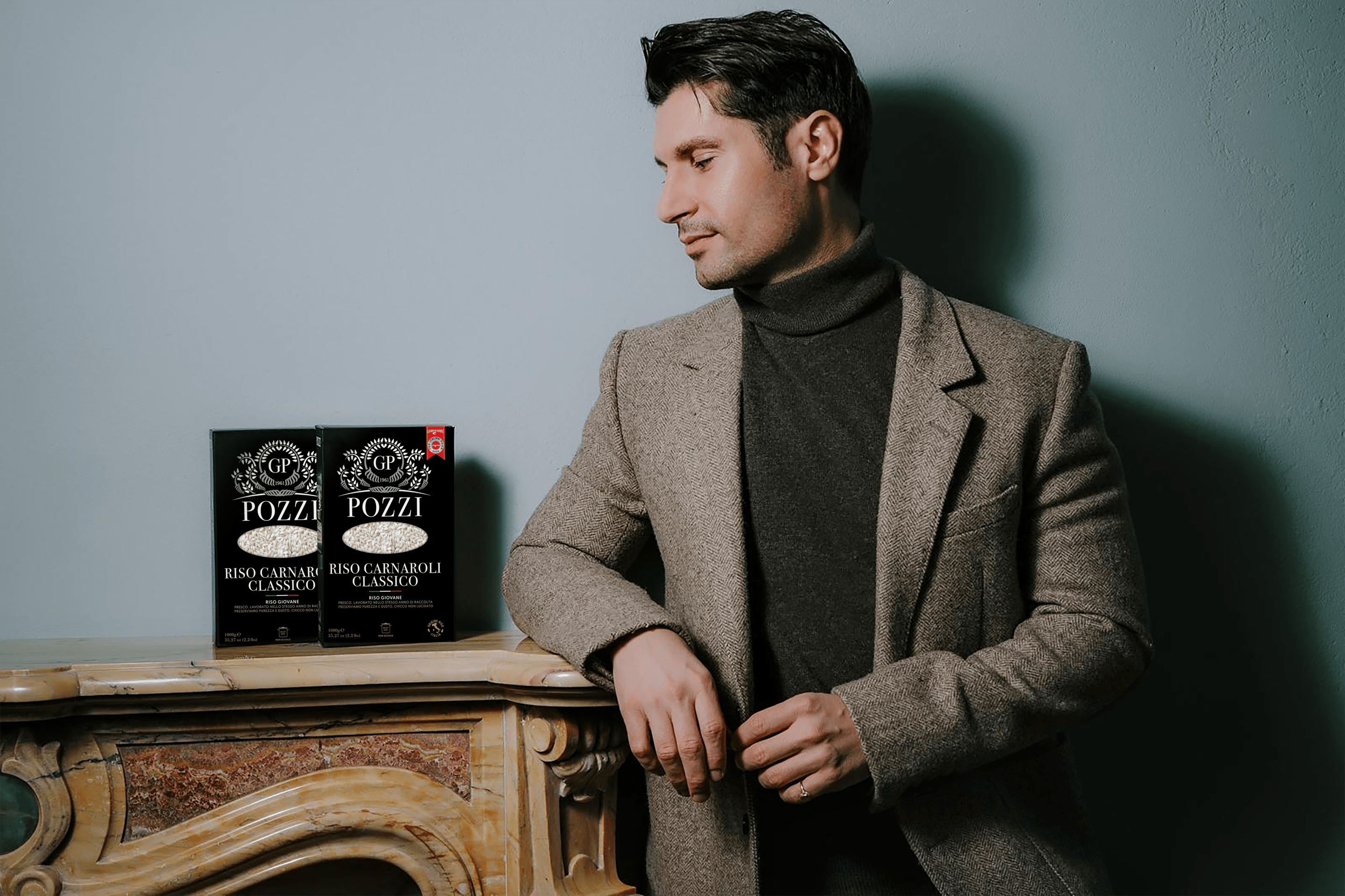 Giorgio Pozzi standing beside Pozzi Rice products.