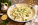 Bowl of ricotta gnocchi tossed in creamy Amalfi Sauce with lemon zest and fresh parsley.
