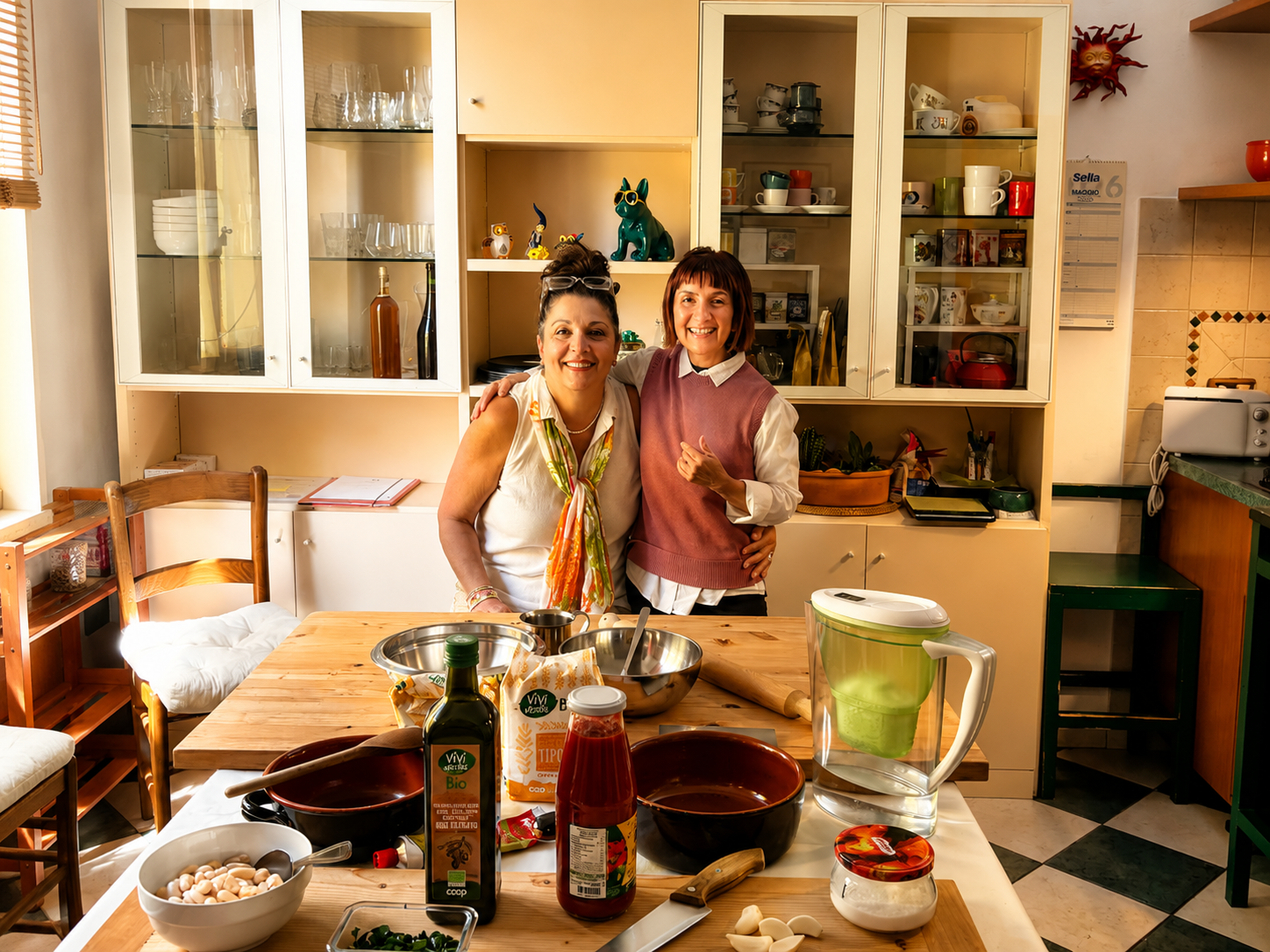 Mandi Casey and Letizia Capodicasa posing together after a pasta-making class in Florence, Italy.