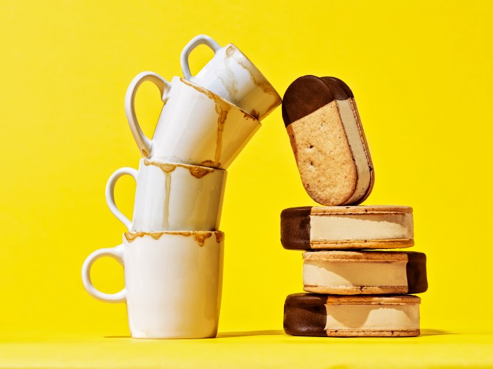 Sammontana's Coffee Gelato Sandwich stacked next to espresso cups with a yellow background