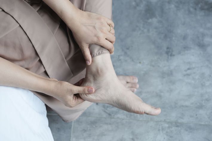 Sore feet being rubbed