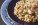 White truffle and mushroom risotto served on a blue plate.
