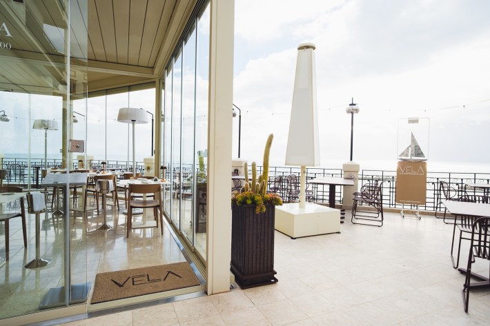 Exterior terrace of Vela restaurant in Sciacca Sicily overlooking the Mediterranean.