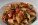Penne pasta with sautéed eggplant, cherry tomatoes, capers, and fresh basil in a light tomato sauce.