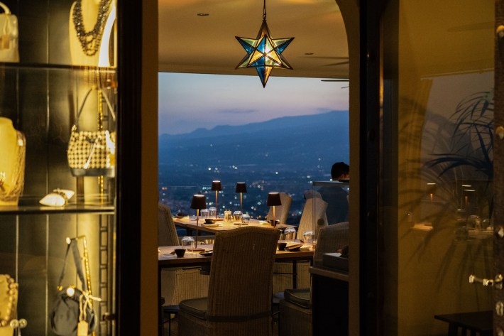 Evening settles over Incanto as diners enjoy one of Taormina's most spectacular views.