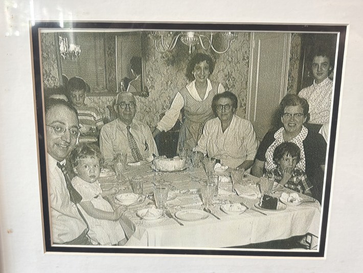 Vintage family photograph displayed inside Sarabella's Italian Deli & Pizzeria.