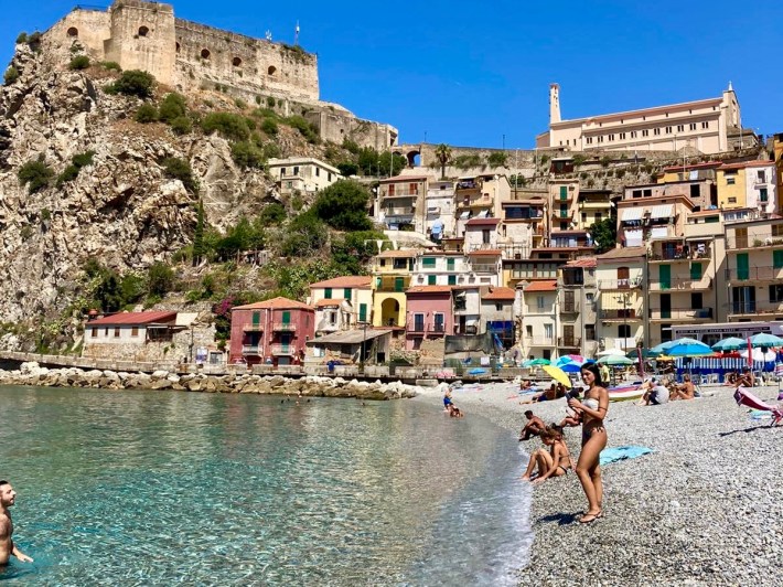 Beach, colorful houses and Ruffo Castle in Scilla, Calabria.