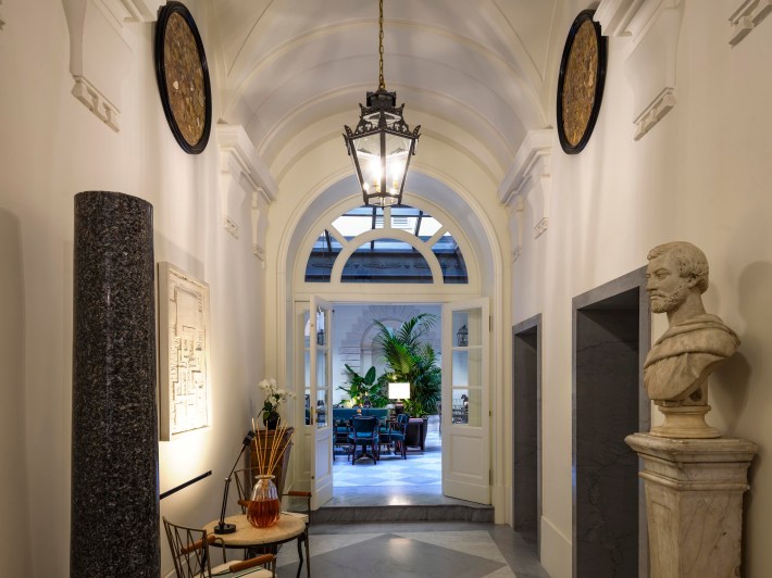 Interior courtyard entrance at Casa J.K. Place Roma in Rome.