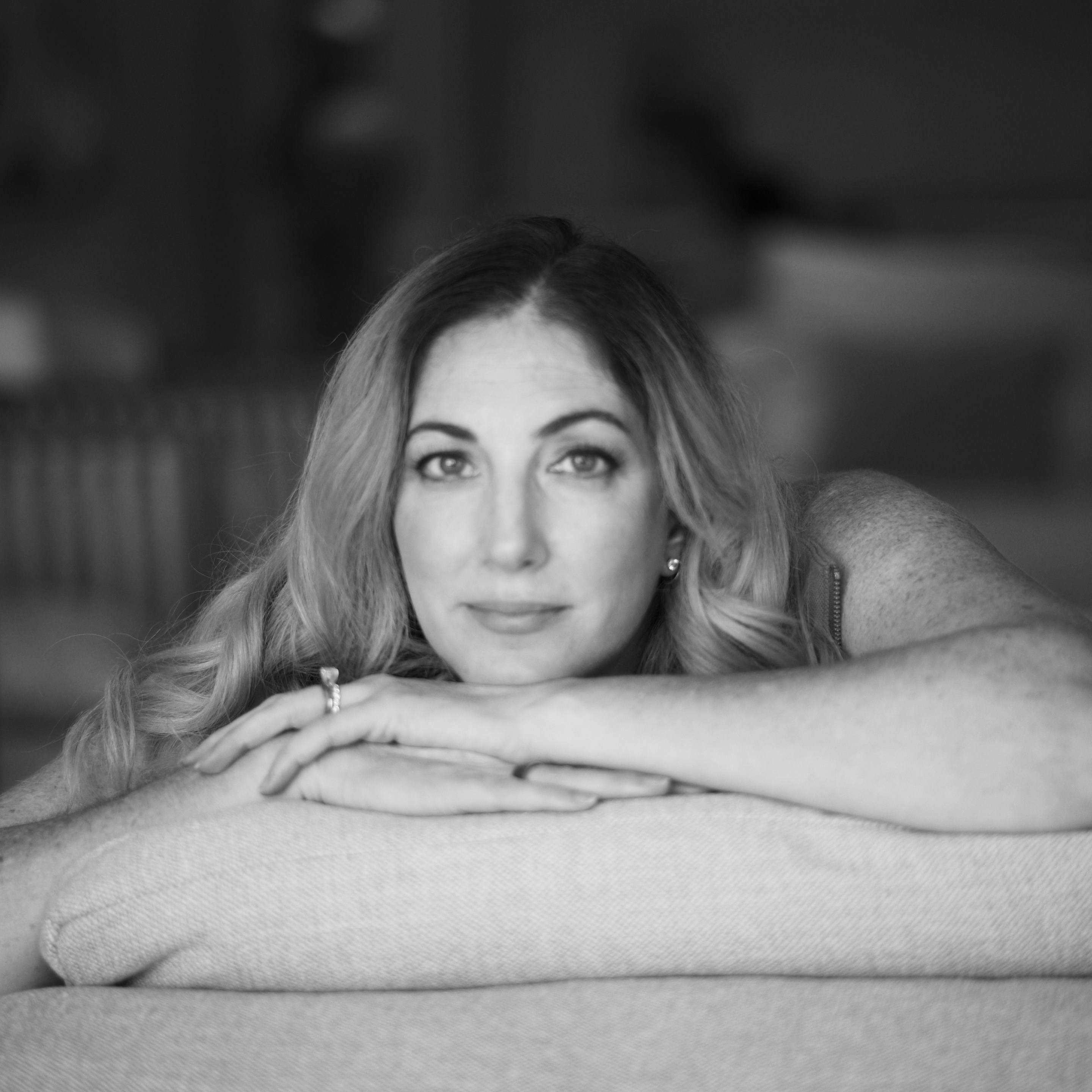 Author Erica D'Arcangelo staring at the camera in black and white