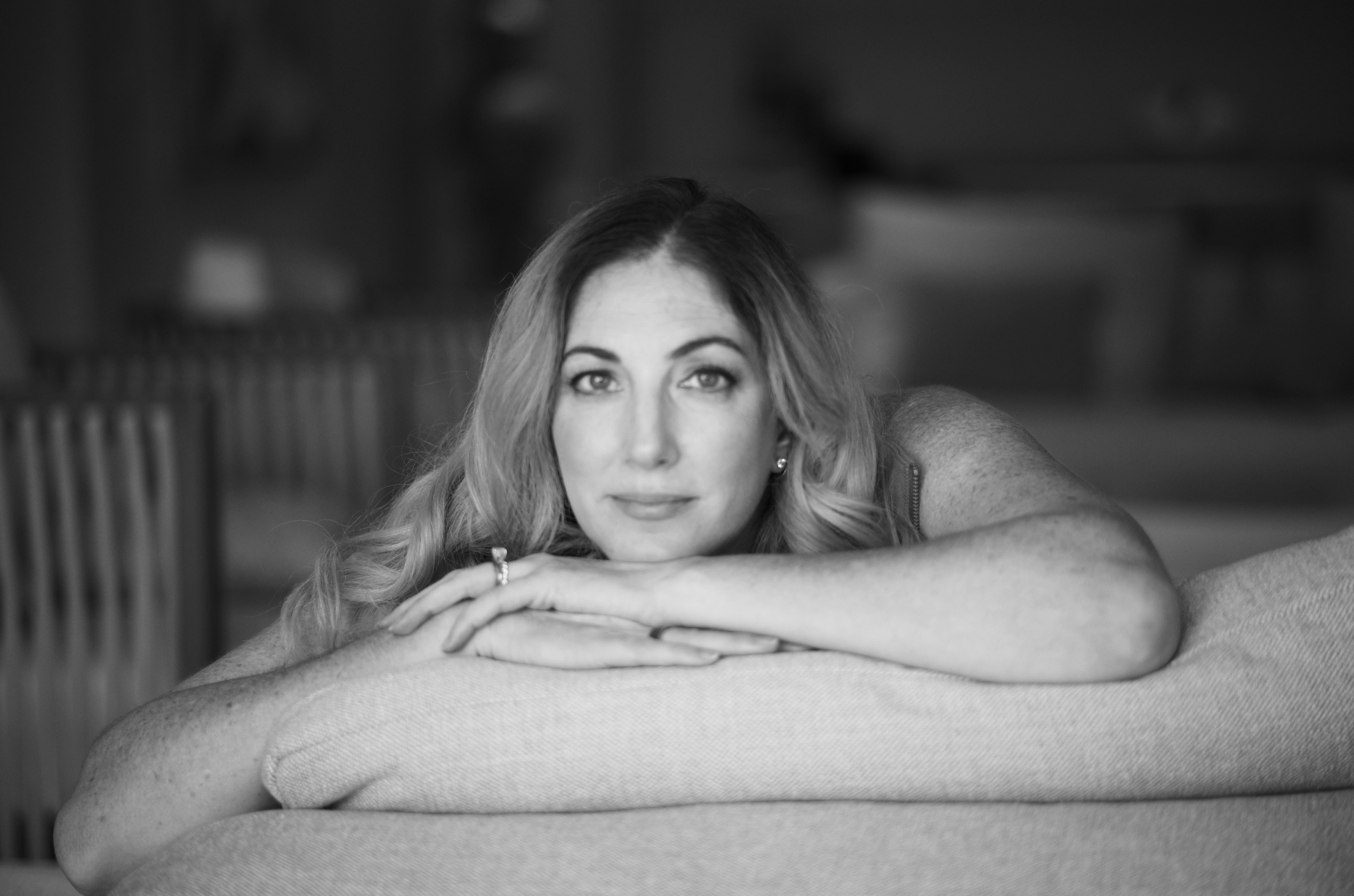Author Erica D'Arcangelo staring at the camera in black and white