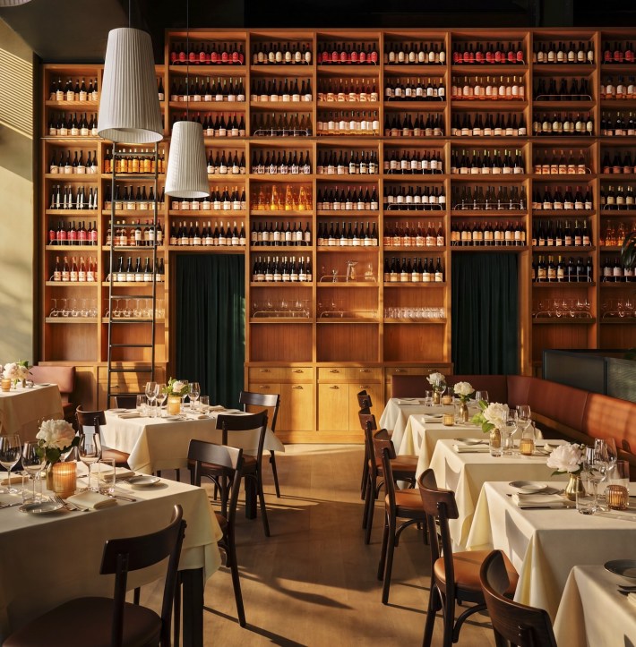 A towering wine wall anchors the dining room at Felice Flatiron. Photo courtesy of SA Hospitality Group.