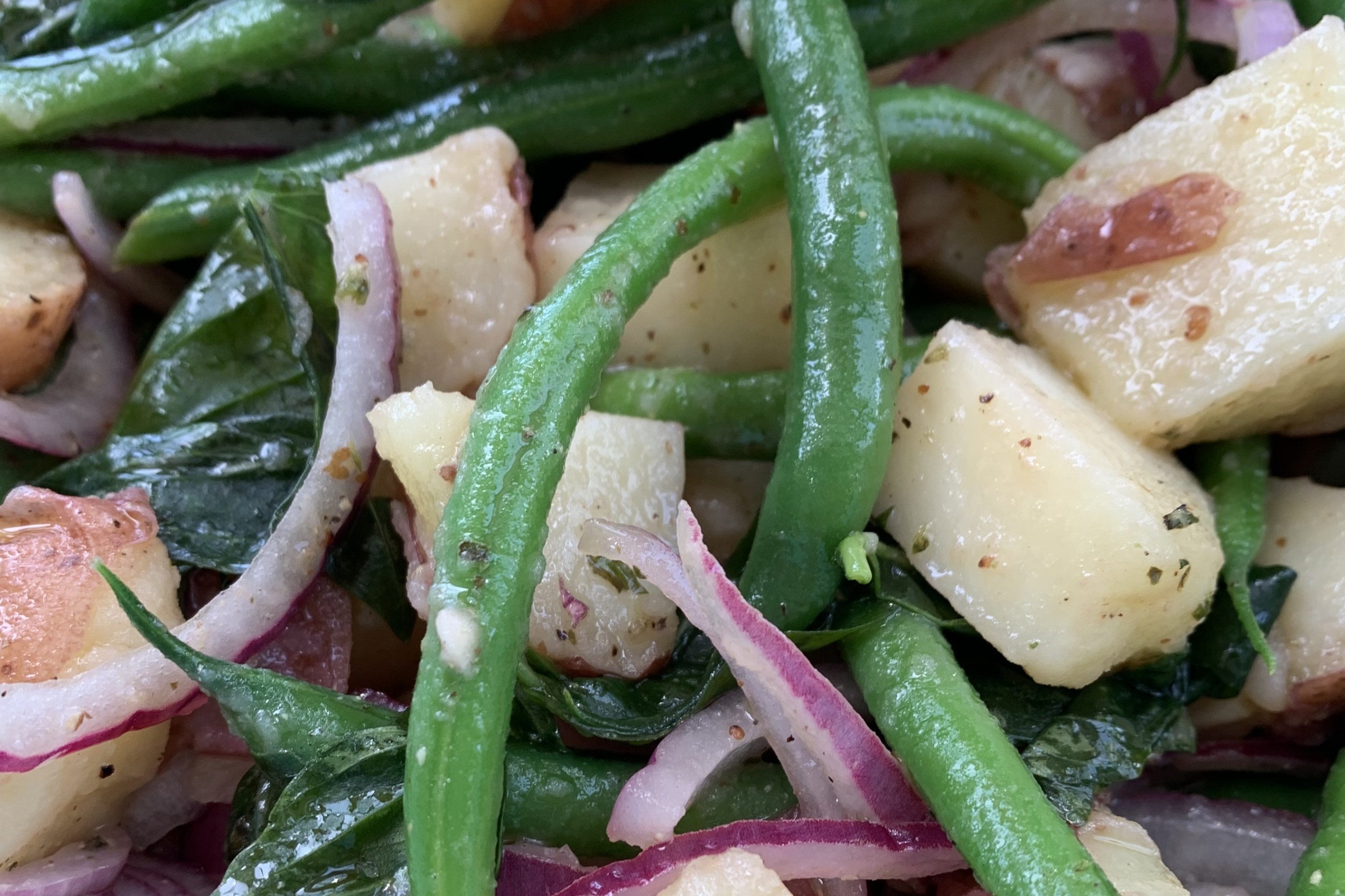 Fresh potatoes, crisp string beans, basil, and red onion come together in this classic Italian summer salad
