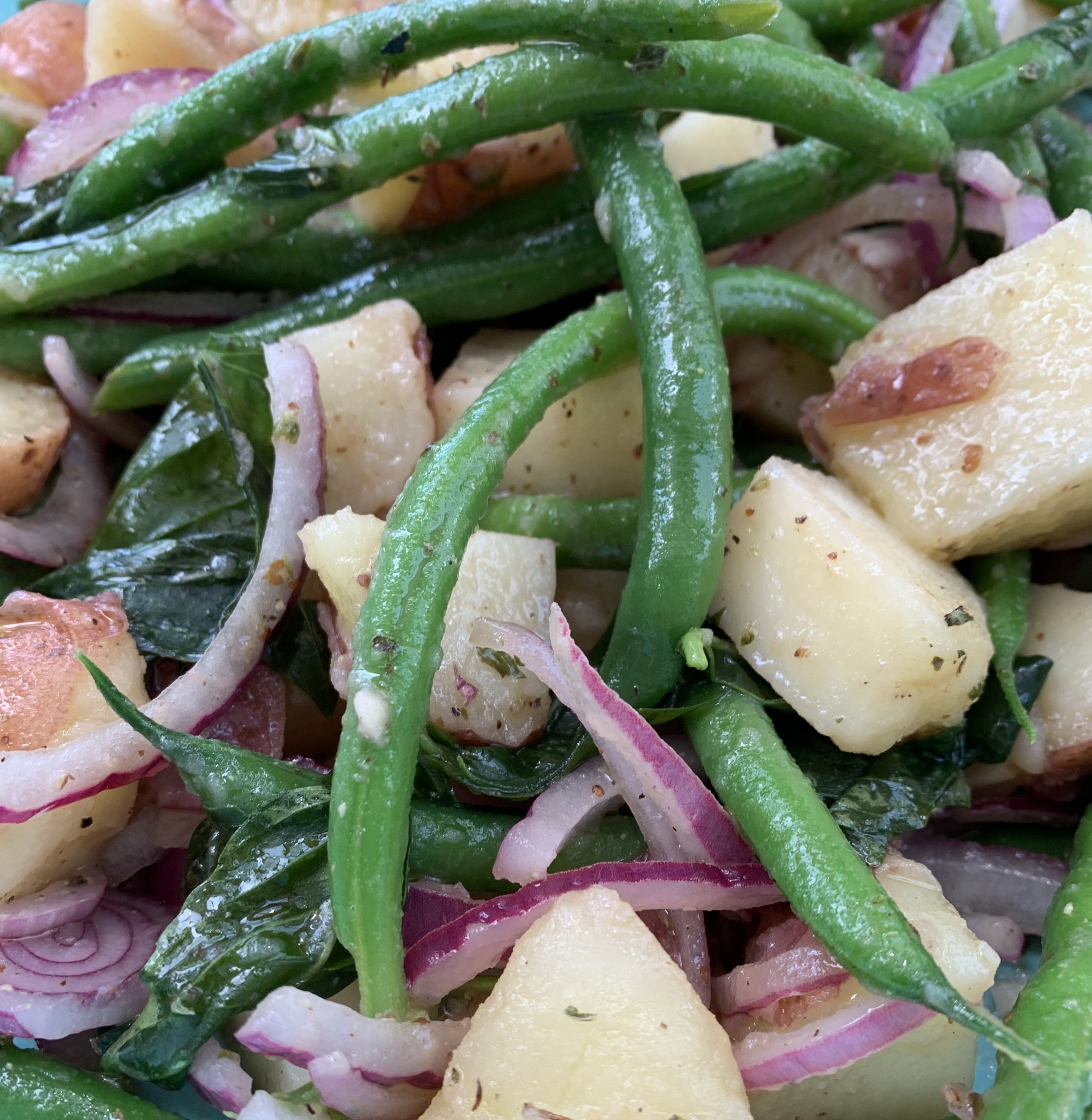 Fresh potatoes, crisp string beans, basil, and red onion come together in this classic Italian summer salad