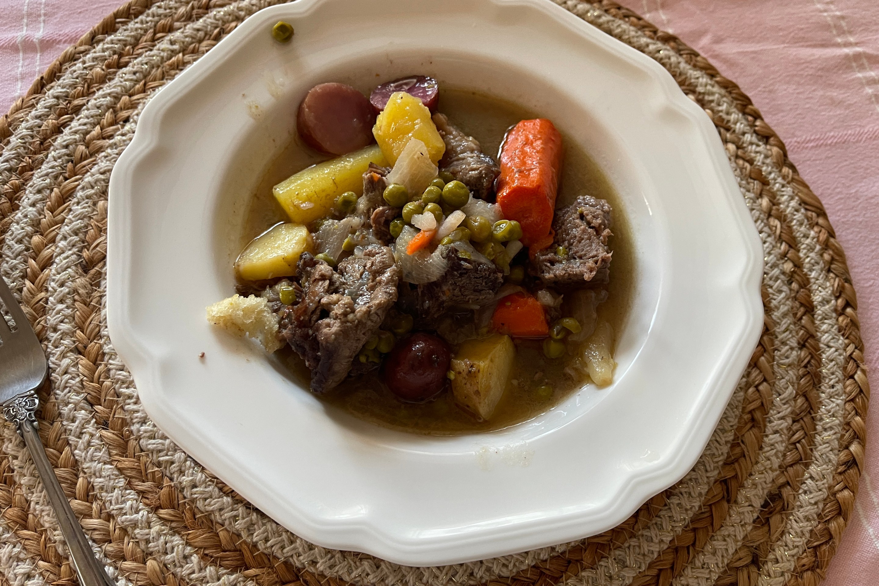 Italian spezzatino made with beef, carrots, potatoes, peas, and onions.