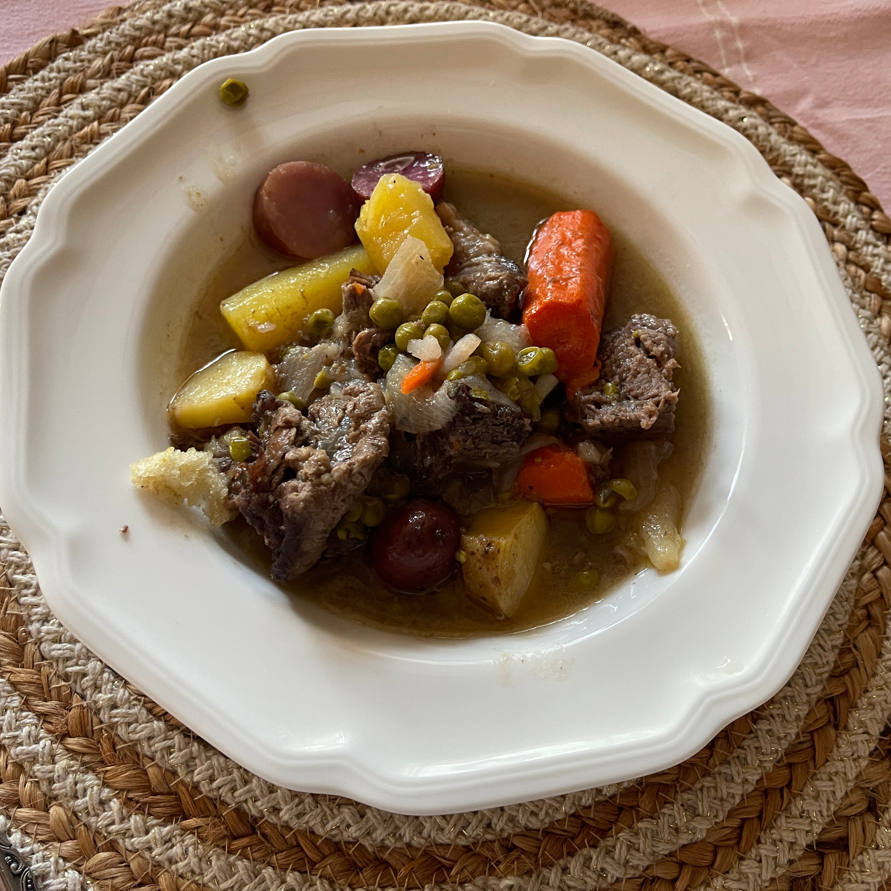 Italian spezzatino made with beef, carrots, potatoes, peas, and onions.