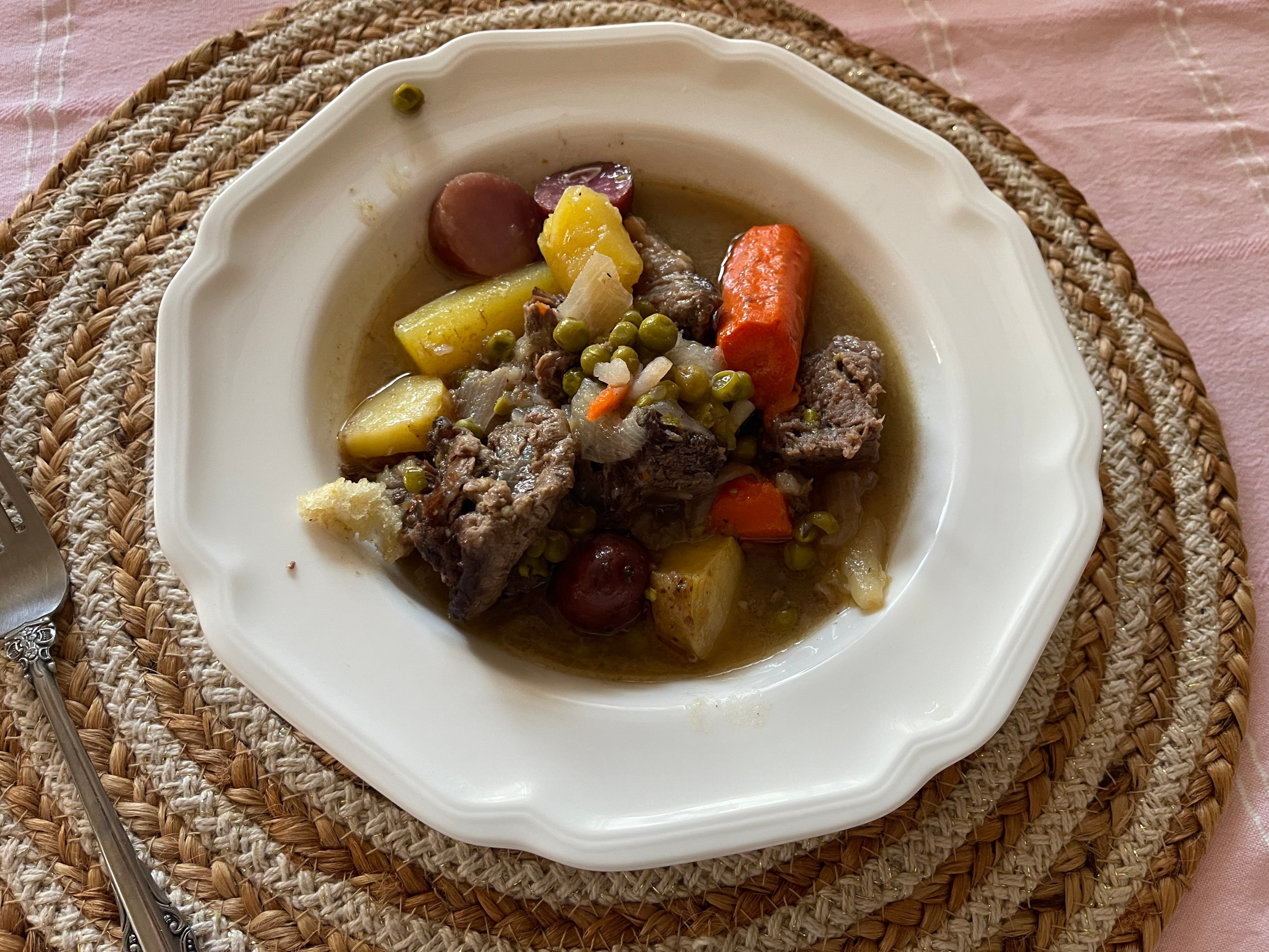 Italian spezzatino made with beef, carrots, potatoes, peas, and onions.