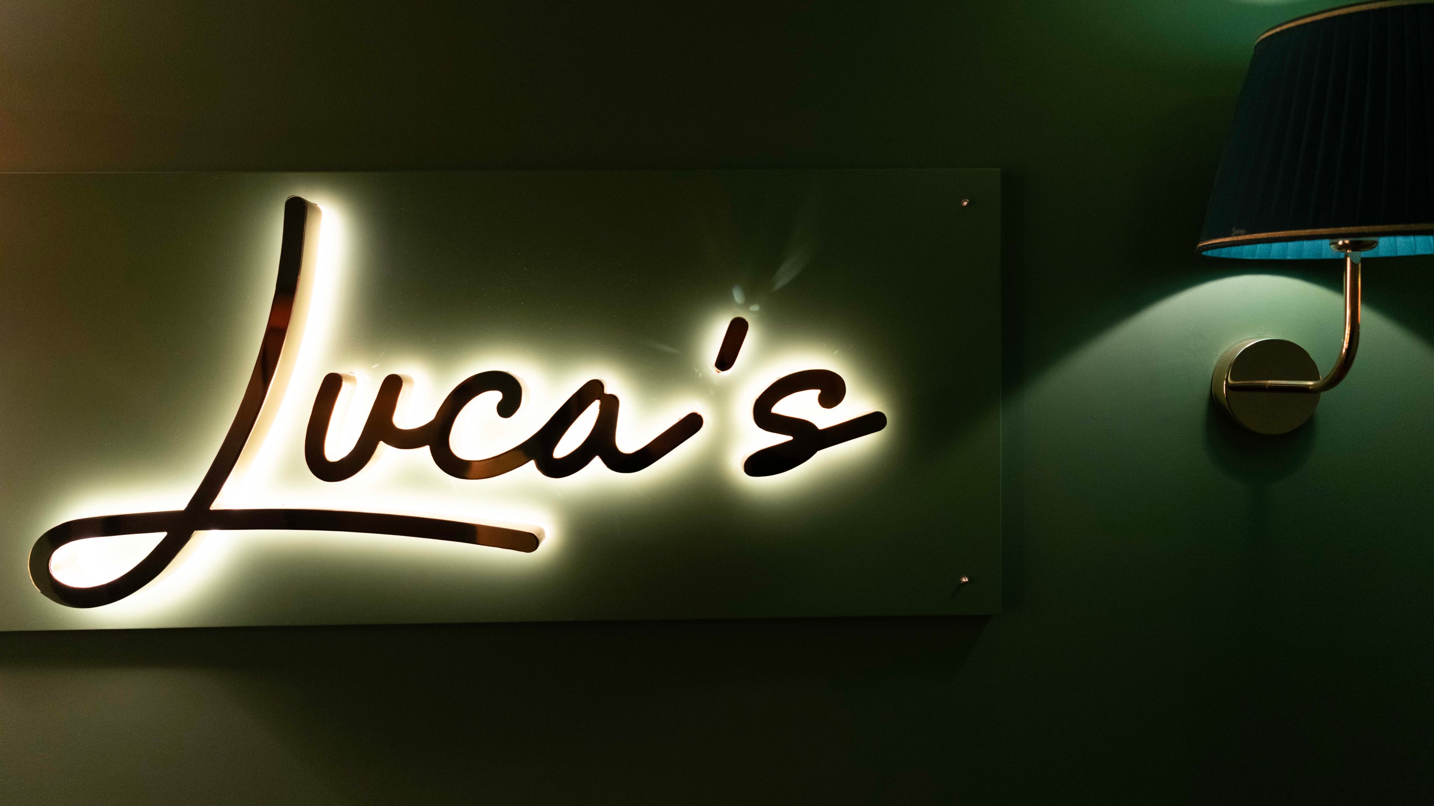 Entrance sign to Luca's restaurant inside Hotel La Gemma in Florence.
