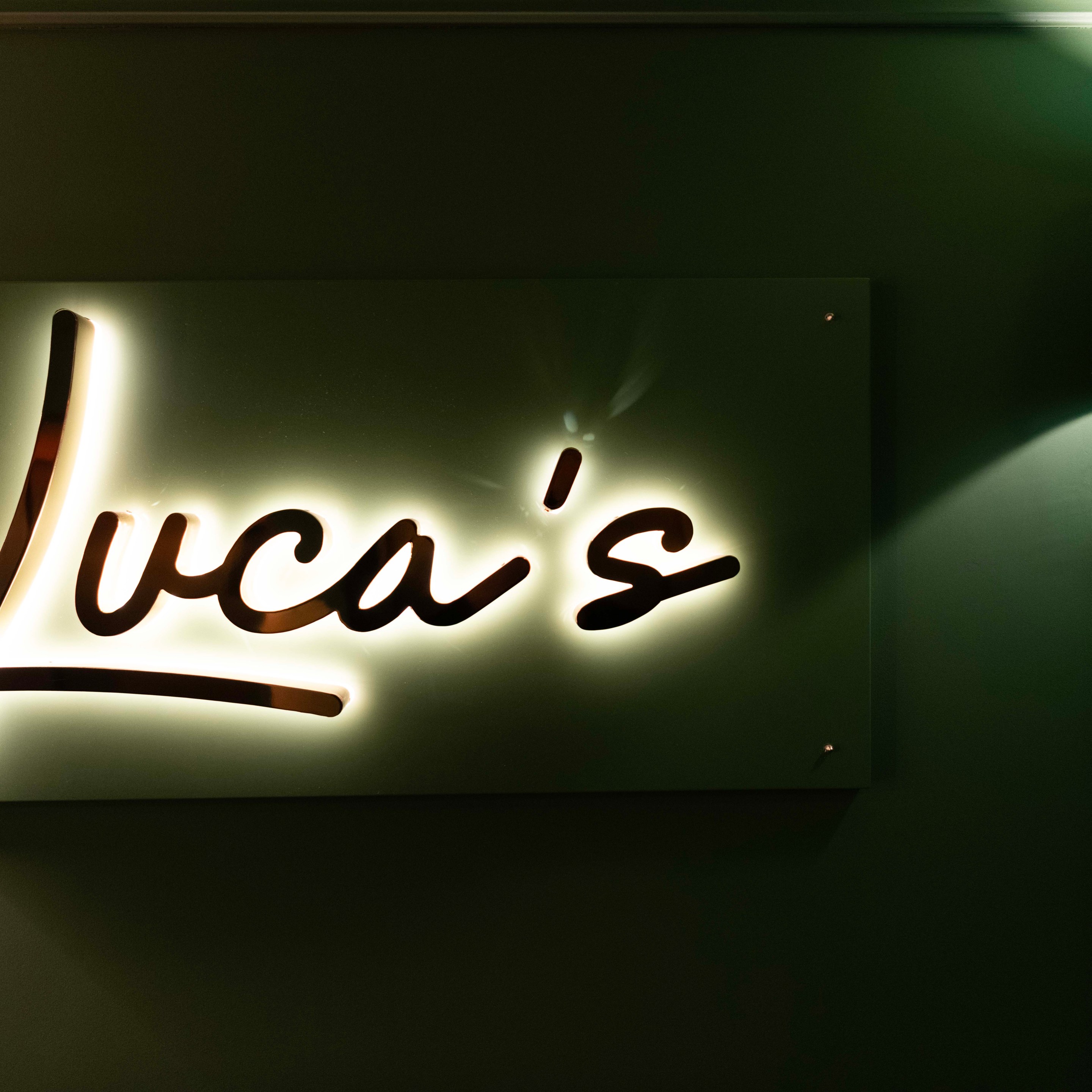 Entrance sign to Luca's restaurant inside Hotel La Gemma in Florence.